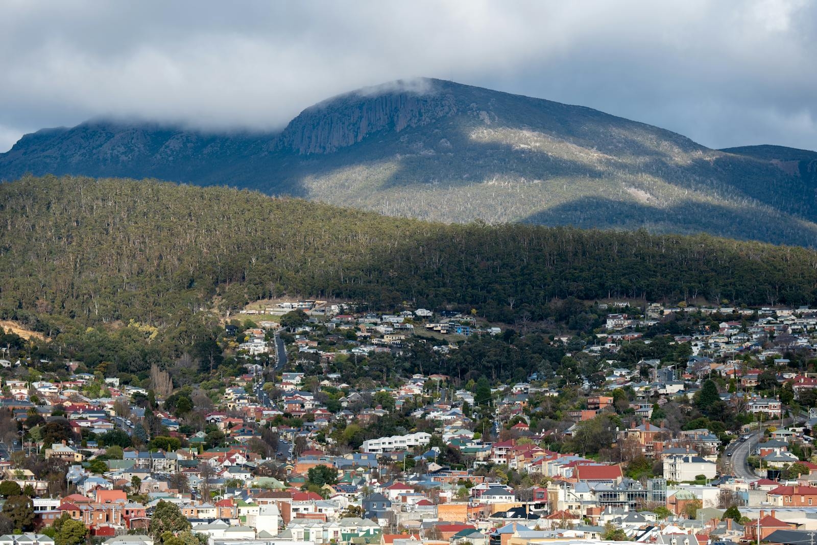 A picturesque view of Hobart cityscape against Mount Wellington in Tasmania, Australia.
