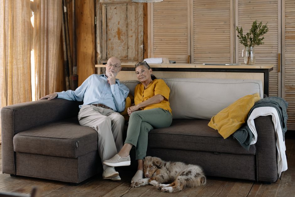 Elderly couple relaxing together at home downsizing lifestyle